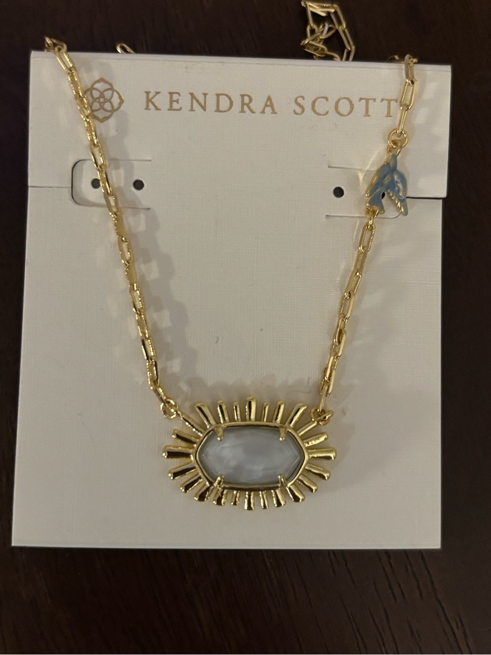 BN Kendra Scott Gold plated Sunburst Necklace with Light Gray Stone & blue bird